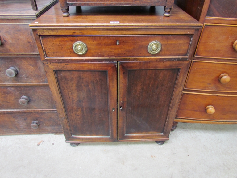 A 19th Century mahogany single drawer over two door cupboard