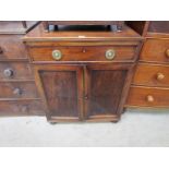 A 19th Century mahogany single drawer over two door cupboard