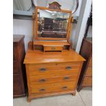 An Edwardian satinwood dressing chest with swing mirror and jewellery drawers