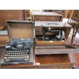A cased Royal typewriter and sewing machine