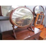 A 1930's inlaid mahogany oval dressing table swing mirror