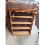 A modern pine open four tier bookcase