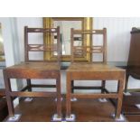 A pair of Georgian oak country side chairs