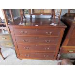 A Victorian mahogany chest of four drawers with swan neck handles