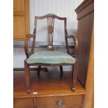 An Edwardian mahogany in ladies bedroom chair with scroll arms for re-upholstery
