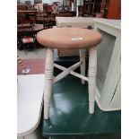 An oak stool with painted legs