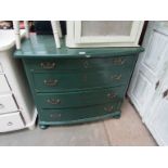 A green painted chest of four bow front drawers