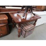 A 1950's oak draw-leaf table