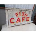 A painted Fish Cafe sign