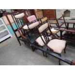 A 1930's beech framed bergere armchair and three Art Nouveau mahogany dining chairs