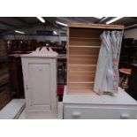 A painted Edwardian mahogany bedside cupboard and shoe rack