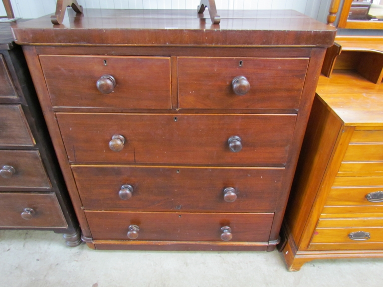 A Victorian mahogany two over three chest of drawers