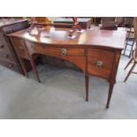 A Georgian mahogany bow fronted sideboard with three drawers 167cm wide