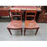 A pair of Victorian mahogany solid seated side chairs,