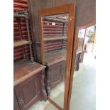 An Edwardian mahogany frame bevelled mirror 152cm tall