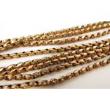 A gold guard chain stamped 9c, 136cm long,