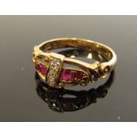 An 18ct gold diamond and ruby ring, marks rubbed. Size P, 3.