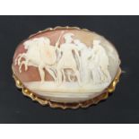 An oval cameo brooch depicting Roman figures and horses and chariot in gold mount, unmarked,