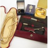 A mixed box of bijouterie including faux pearls, earrings,