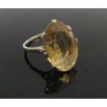 An oval citrine ring 18mm x 13mm, shank stamped 765. Size M, 5.