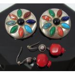 A pair of large white metal clip-on earrings with ovoid cabochon stones including turquoise and