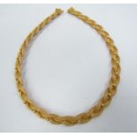 A woven plaited necklace with ball detail stamped 750, 44cm long,
