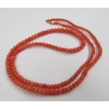 A coral bead necklace,