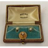 A pair of single pearl set shirt studs unmarked and a single stud set with old cut diamond,