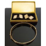A pair of 9ct gold plated on silver cufflinks and a 9ct gold plated on bronze bangle