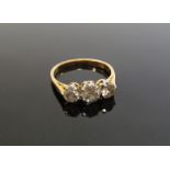 A gold three stone diamond ring 1ct total approx, stamped 18ct. Size L, 2.