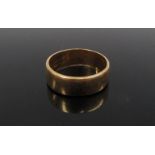 An 18ct gold wedding band, 5mm wide. Size L, 4.