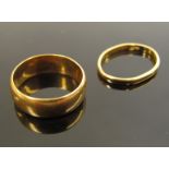 A 22ct gold band, 5mm wide. Size M. London 1916, 7g and a 22ct gold band, 1.