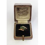 A 9ct gold ring set with two green stones (possibly jade) in crossover setting. Size N, 2.