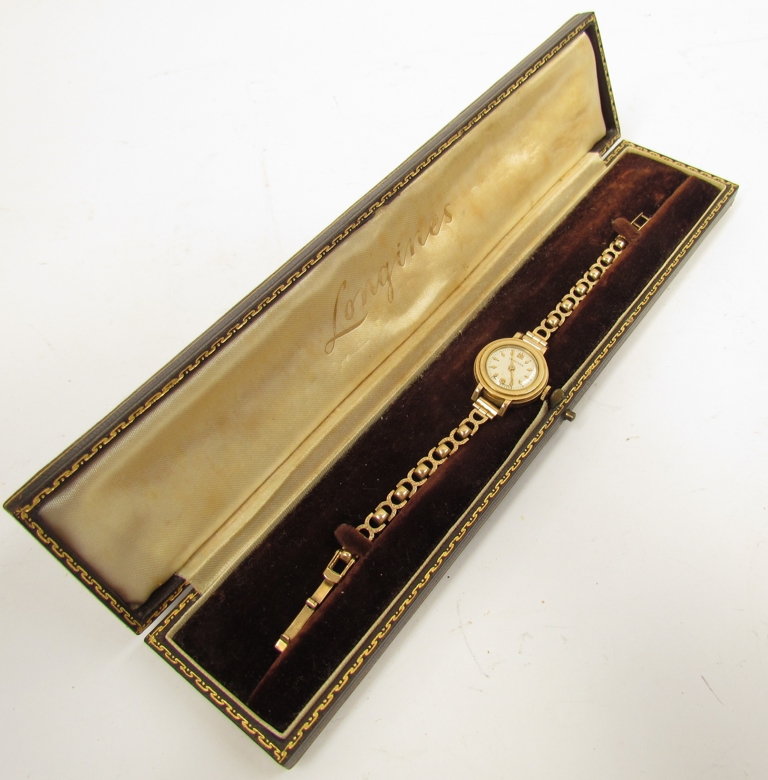 A 9ct gold lady's Longines wristwatch in case, 14.