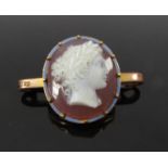 A gold framed cameo bar brooch the cameo of female framed by blue enamel border, unmarked, 7.