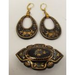 A pair of tortoiseshell pique drop earrings on later rolled gold fixings,