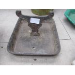 A cast iron tray design boot scraper. Tray 26.