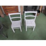 Two chidren's wooden school chairs