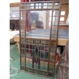 A cast iorn framed multi-panelled lead glazed stained glass window,