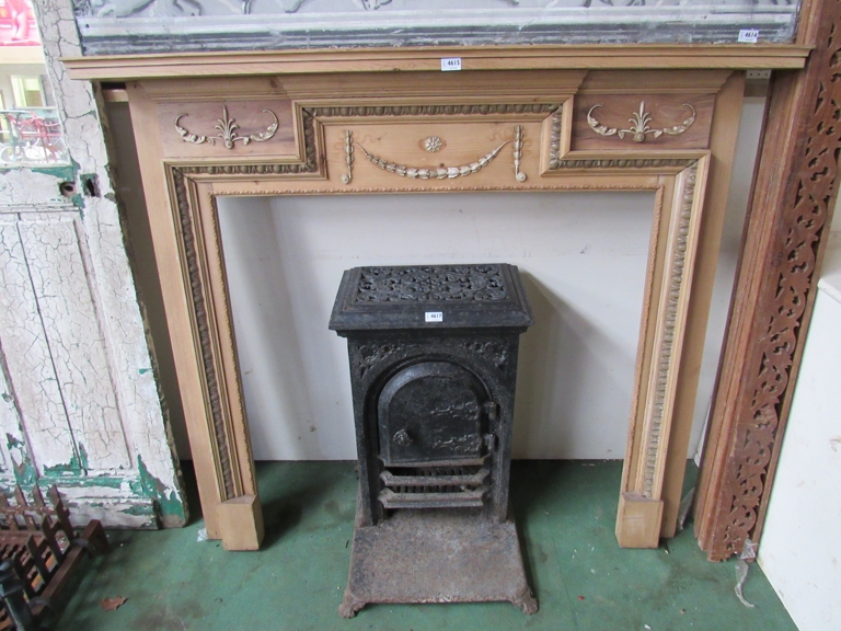A 19th Century stripped pine fire surround.
