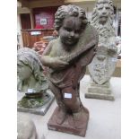 A pair of cast iron "Putti" style figures of musicians.
