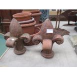 Two terracotta finials.