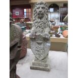 A pair of reconstituted lion statues holding shields. 81.