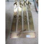 Nine brass door handles with integrated finger plates