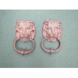 Two brass lion head door knockers