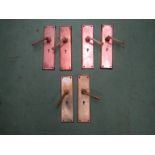 Six copper/brass door handles with back plates