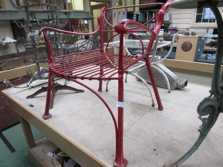 A 1920's metal garden chair, X shape back,