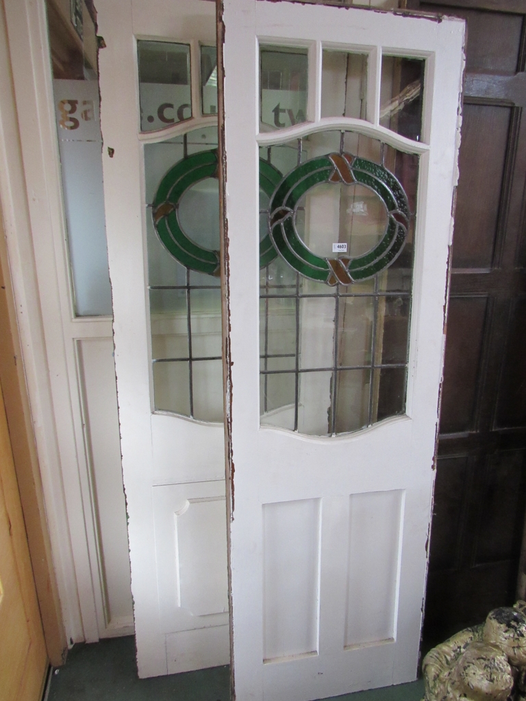 A 1920s painted pine French door, with coloured lead glass.