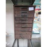 A small metal nine drawer workshop cabinet. 32.5 x 18.