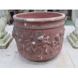 A large terracotta planter, cherub body. 41.5cm diameter.